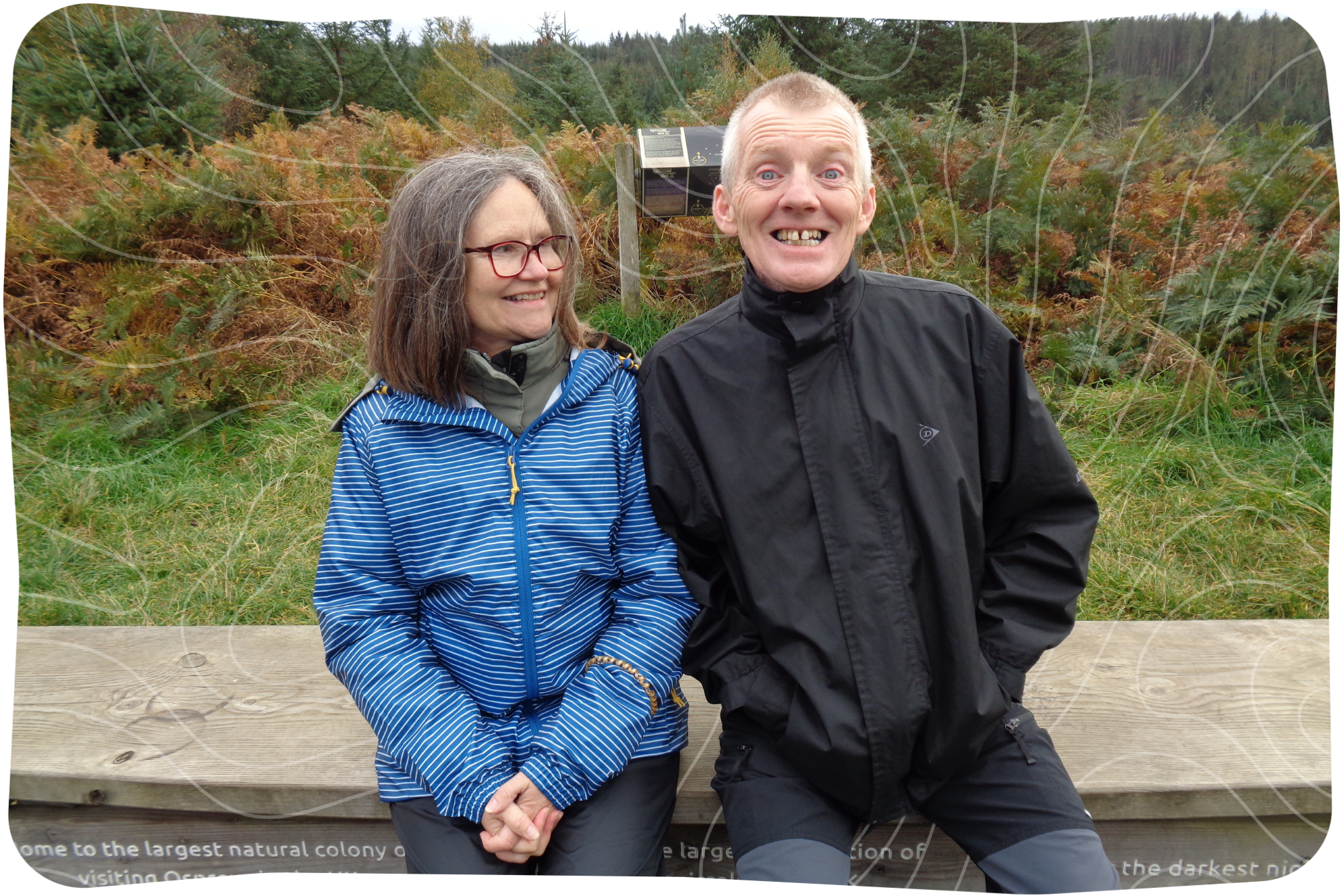 Sue and Andy sat on a wall together.
