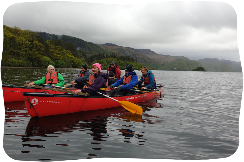 Volunteers on a Dementia Adventure holiday kayaking